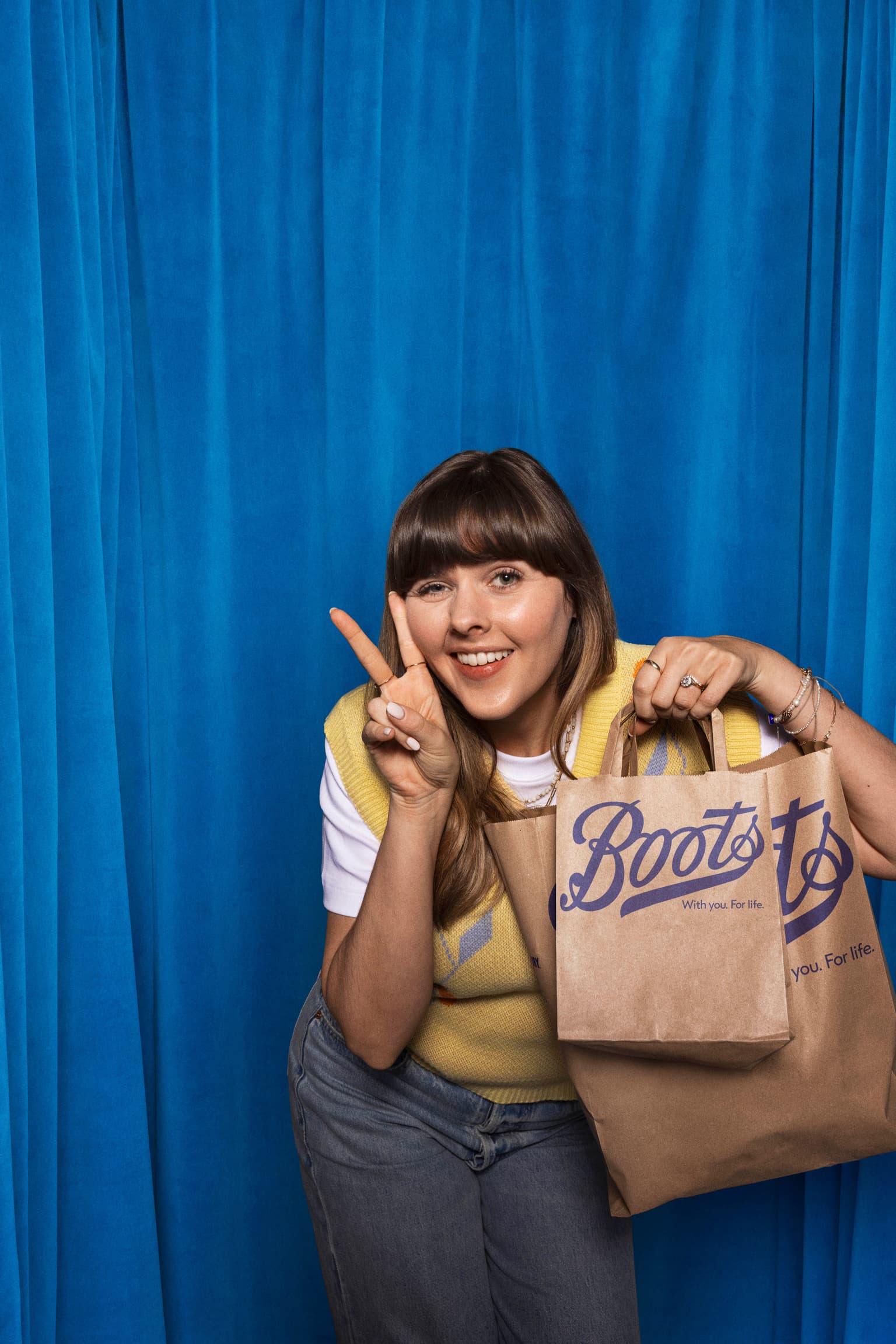 Boots Ad Abby Peace sign